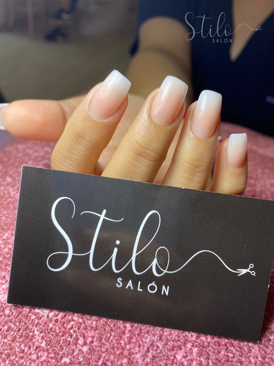 Long gel nails with a white French tip done at Stilo Salón, Roma Norte